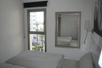 Postel nebo postele na pokoji v ubytování Modern apartment with stunning sea view