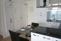 Kuchyň nebo kuchyňský kout v ubytování Modern apartment with stunning sea view