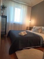 Łóżko lub łóżka w pokoju w obiekcie AnJa Apartment