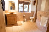 a bathroom with a sink and a toilet at Beautiful renovated chalet near ski resort France in Arâches-la-Frasse