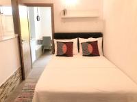 Posteľ alebo postele v izbe v ubytovaní Apartments & Rooms Formenti