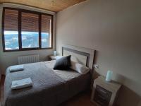 Postel nebo postele na pokoji v ubytování Apartamentos Mirador de Gúdar