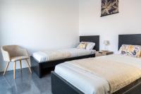 Postel nebo postele na pokoji v ubytování Villa Santiago