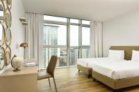 Łóżko lub łóżka w pokoju w obiekcie Torre Galfa Milano Luxury Apartments | UNA Esperienze