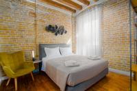 Postel nebo postele na pokoji v ubytování Curcumelli Luxury Suites - Κorkira