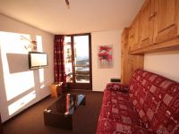 a living room with a couch and a table and a window at Appartement Les Saisies, 3 pièces, 6 personnes - FR-1-293-80 in Les Saisies