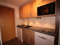 a kitchen with a sink and a microwave at Appartement Les Saisies, 3 pièces, 6 personnes - FR-1-293-80 in Les Saisies