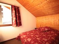 a bedroom with a bed and a window at Appartement Les Saisies, 3 pièces, 6 personnes - FR-1-293-80 in Les Saisies