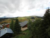 a view of a village with trees and buildings at Appartement Les Saisies, 3 pièces, 6 personnes - FR-1-293-80 in Les Saisies