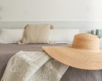 A bed or beds in a room at B&B Oplonti Resort