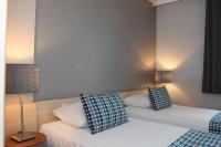Posteľ alebo postele v izbe v ubytovaní Hotel Perła
