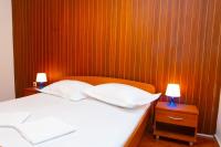 Posteľ alebo postele v izbe v ubytovaní Apartmani Vranjes