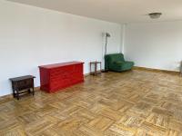 an empty room with a red dresser and a green chair at Magnifique villa de charme avec piscine in Casteljaloux