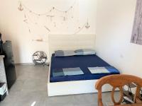 A bed or beds in a room at L'Ancora La Ciaccia