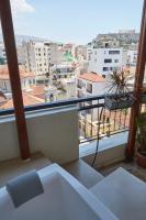 A balcony or terrace at Mosaics Astonishing Acropolis view Aprtm