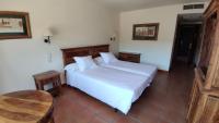 Postel nebo postele na pokoji v ubytování La Figuerola Hotel & Restaurant