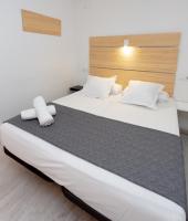 Postel nebo postele na pokoji v ubytování Easy Sants by Bossh!