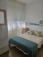 A bed or beds in a room at Apartamento en Isla Cristina Puerto Deportivo