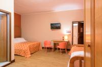 A bed or beds in a room at Leone de Castris Wine Hotel
