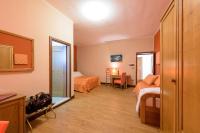A bed or beds in a room at Leone de Castris Wine Hotel