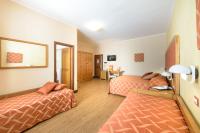 A bed or beds in a room at Leone de Castris Wine Hotel