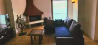 Televízia a/alebo spoločenská miestnosť v ubytovaní Castello Apartment