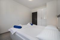 Postel nebo postele na pokoji v ubytování Apartments BlueView