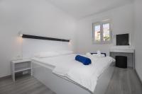 Postel nebo postele na pokoji v ubytování Apartments BlueView