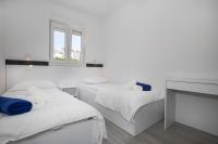 Postel nebo postele na pokoji v ubytování Apartments BlueView