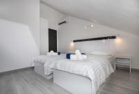 Postel nebo postele na pokoji v ubytování Apartments BlueView