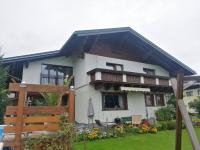 a white house with a black roof at Ferienwohnung Familie Wieser in Altenmarkt im Pongau