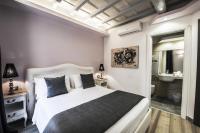 Corso Suite 107 Rooms Wellness & Spaにあるベッド