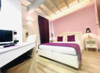 Corso Suite 107 Rooms Wellness & Spaにあるベッド