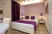 Corso Suite 107 Rooms Wellness & Spaにあるベッド