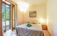 Posteľ alebo postele v izbe v ubytovaní Appartamenti Villa Ortensia