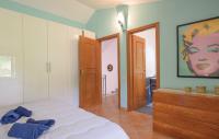 Posteľ alebo postele v izbe v ubytovaní Appartamenti Villa Ortensia
