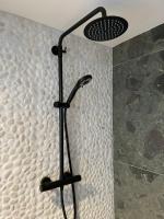 a shower in a bathroom with a bunch of bubbles at Het Lichthuis in Zandvoort