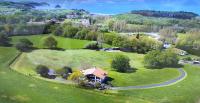 an aerial view of a house in a green field at Amama Baita in Urrugne