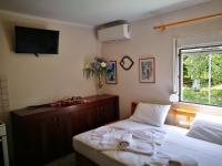 Postel nebo postele na pokoji v ubytování Cristi Apartments