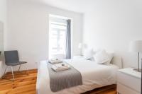 Postel nebo postele na pokoji v ubytování Lisboa Sweet Family Homestay