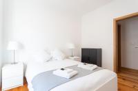 Postel nebo postele na pokoji v ubytování Lisboa Sweet Family Homestay