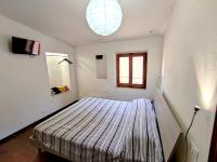 Posteľ alebo postele v izbe v ubytovaní Casa via della Rocca Luna