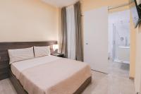 Posteľ alebo postele v izbe v ubytovaní ADRIA Luxury Residence - Centro Trieste