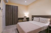 Posteľ alebo postele v izbe v ubytovaní ADRIA Luxury Residence - Centro Trieste