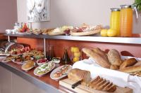 a buffet with a lot of different types of food at Almira Hotel in Arkoudi