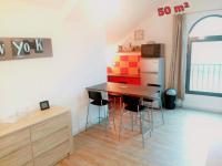 a kitchen with a table and chairs in a room at Appartements T2 Proche de Rennes in Chantepie