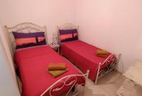 A bed or beds in a room at La Nuova Casetta