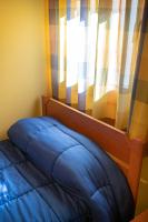 Postel nebo postele na pokoji v ubytování Hostal El Trillero
