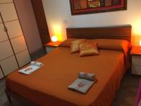 A bed or beds in a room at VILLA VITTORIA with PRIVATE HEATED SWIMMING POOL COMPLETE WITH HIDROMASSAGE FOR EXCLUSIVE USE , SEA VIEW, 150 METERS FROM THE BEACH