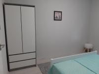 A bed or beds in a room at Jade Vendégház